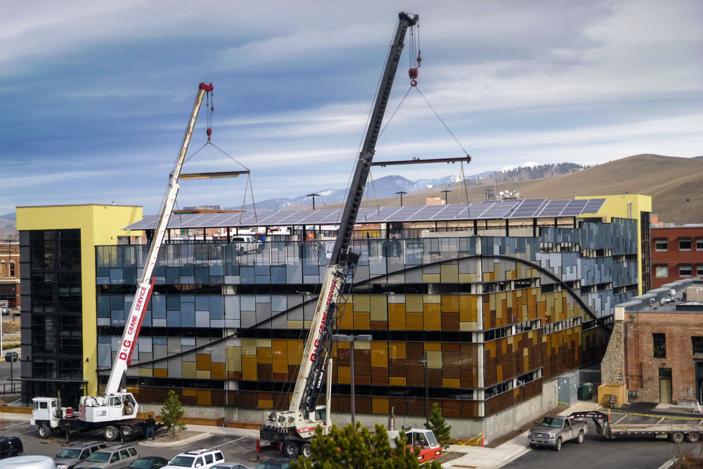 installation with cranes of 85 kilowatt solar array in missoula montana parking structure